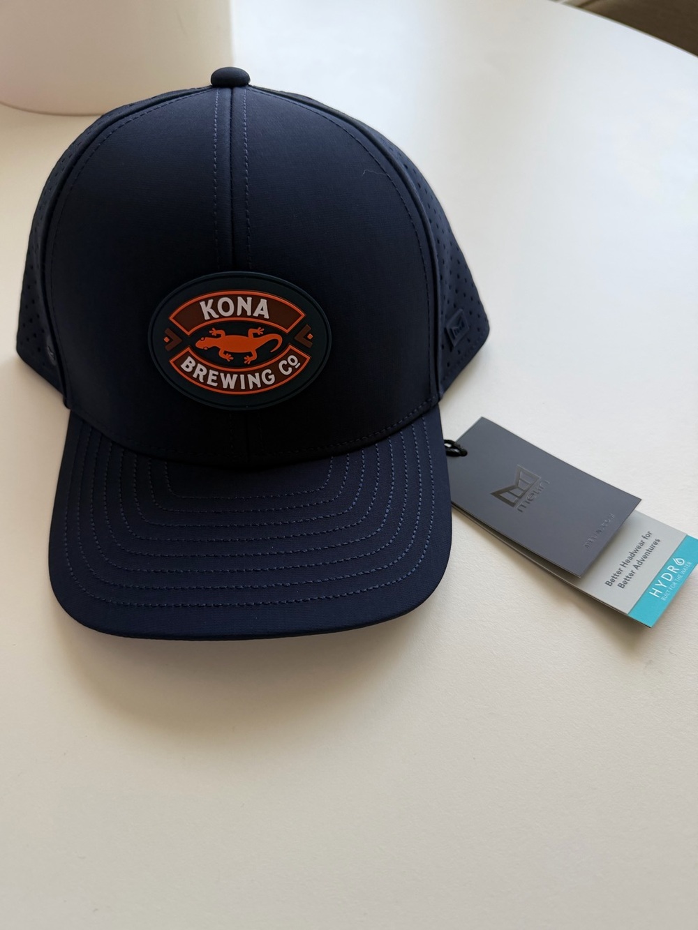 MELIN A-Game HYDRO Cap in Navy Kona Brewing Co. NWT